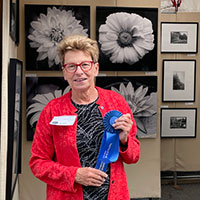 Laura Denardo with Best Photography Award at Tephra Arts Festival in 2025